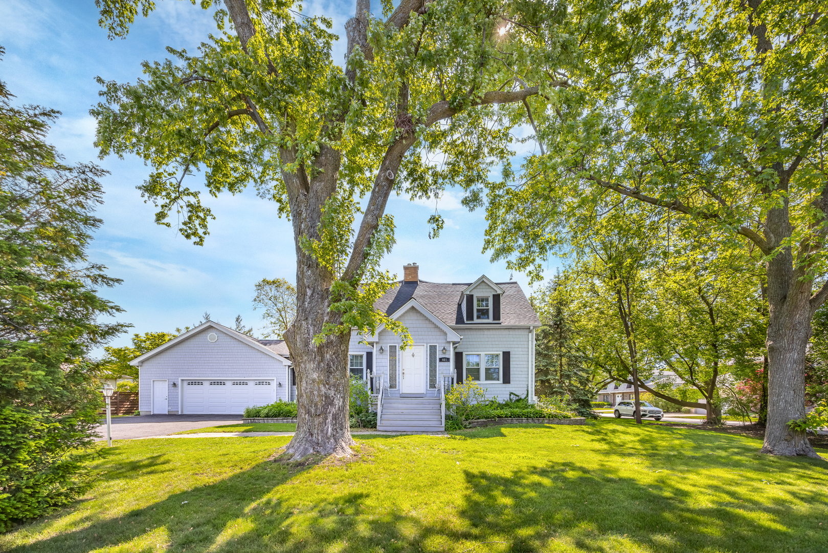401 Greenwood Road Glenview, IL 60025 - Photo 2 of 30 a front view of a house with a yard