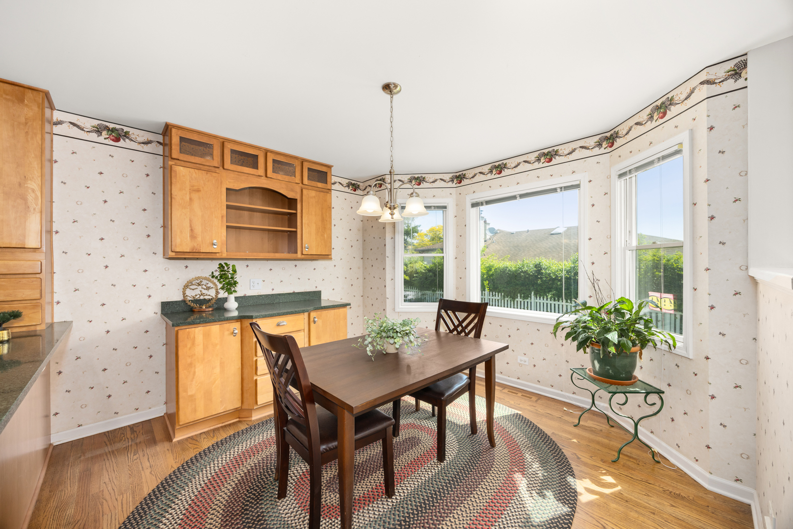401 Greenwood Road Glenview, IL 60025 - Photo 10 of 30 a view of a dining room with furniture window and wooden floor