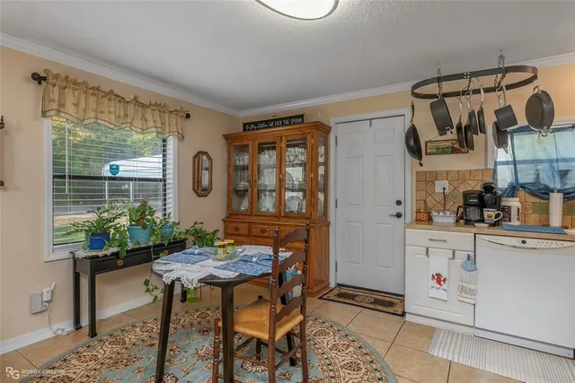 a kitchen with a table and chairs in it