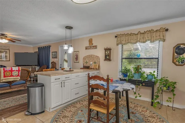 a kitchen with a sink and a stove top oven