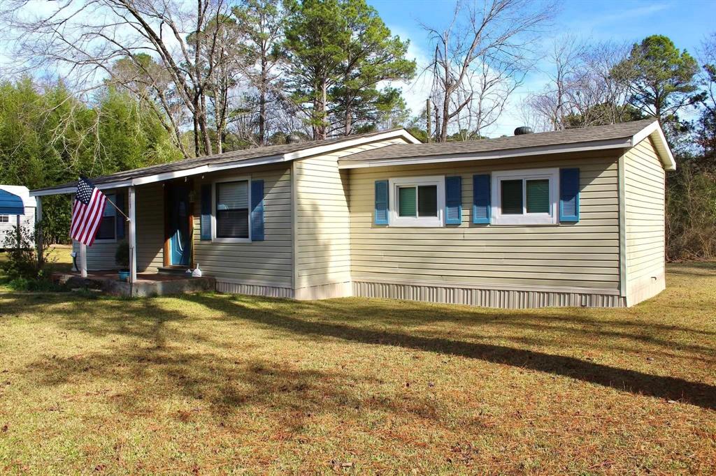 213 Bossier Street Heflin, LA 71039 - Photo 5 of 32 a view of a house with snow on the wall
