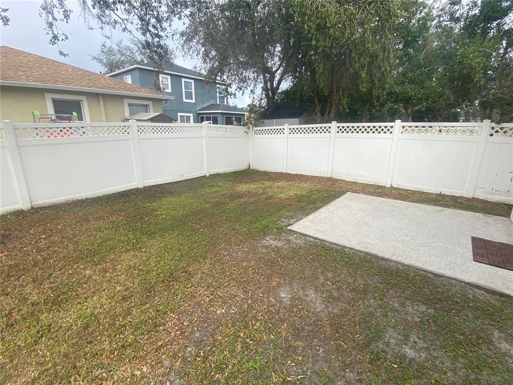 2409 Spring Hollow Loop Wesley Chapel, FL 33544 - Photo 26 of 47 a view of a backyard with large trees