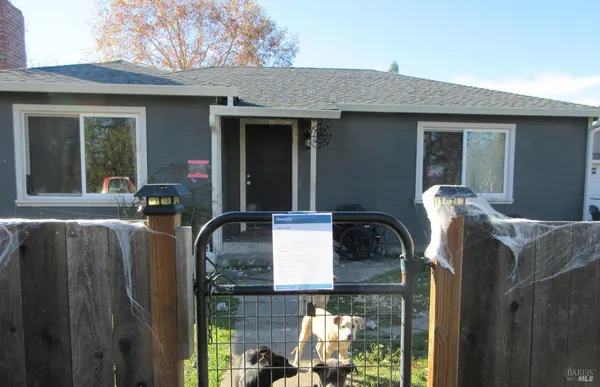 a front view of a house with outdoor space