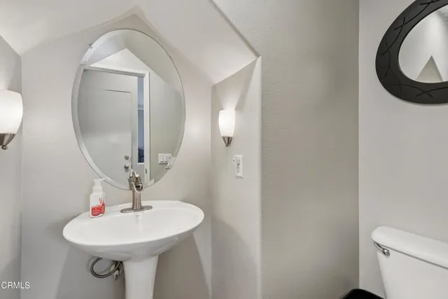 a bathroom with a sink and mirror