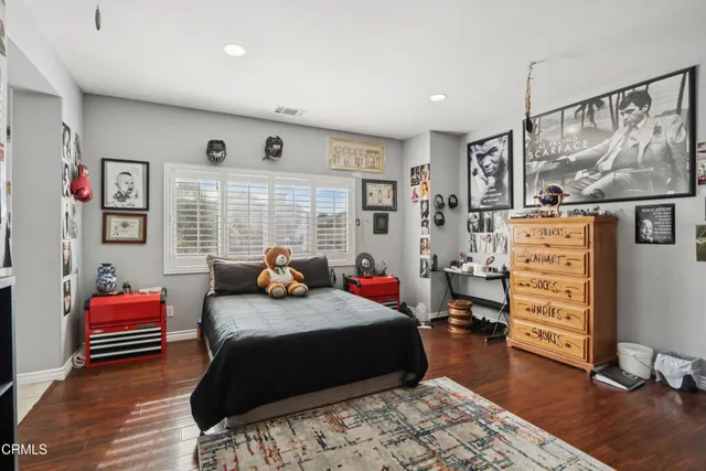 a bedroom with bed and a window