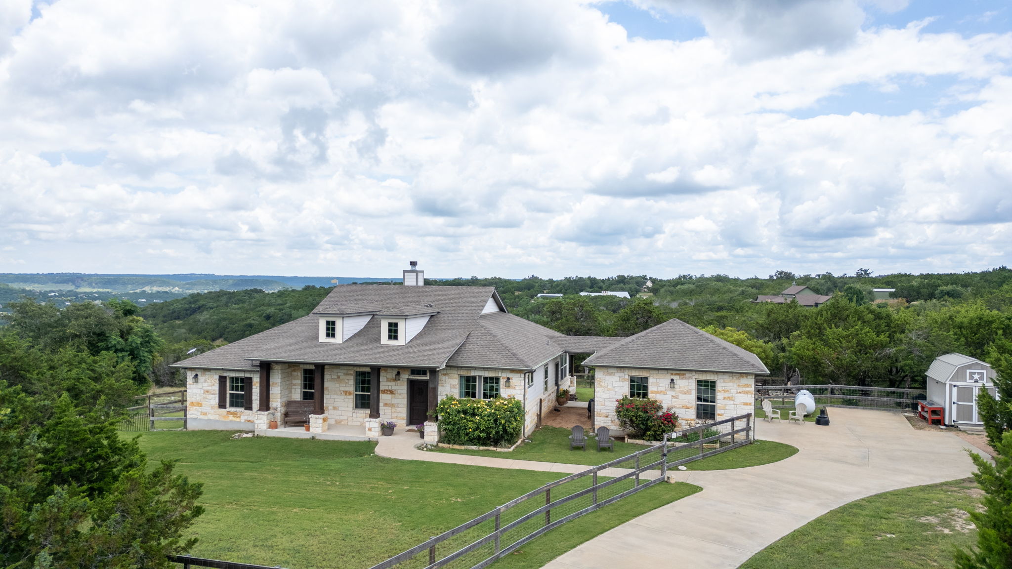 155 Balcones Ridge Way Bertram, TX 78605 - Photo 1 of 37 The home is set in a scenic landscape with amazing views of the surrounding hills
