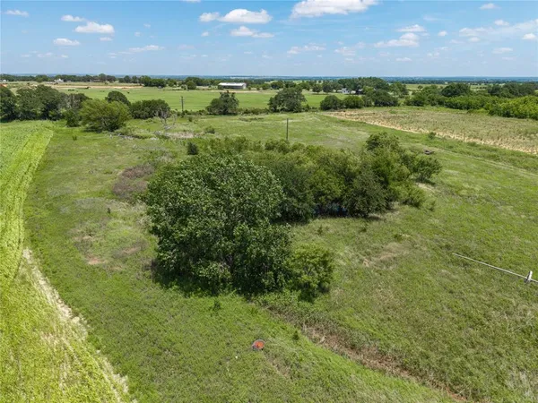 a view of a lake with a yard