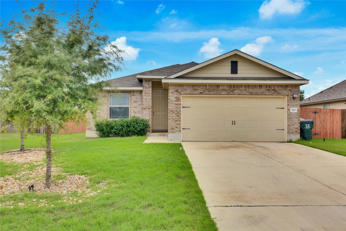 220 Evening Dusk Drive Kyle, TX 78640 - Photo 1 of 1 a front view of a house with a yard