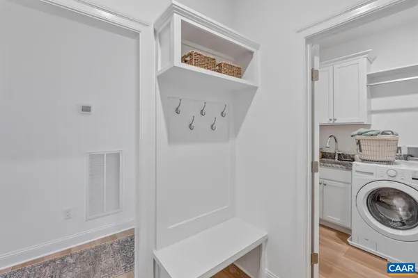 a view of a hallway with washer and dryer
