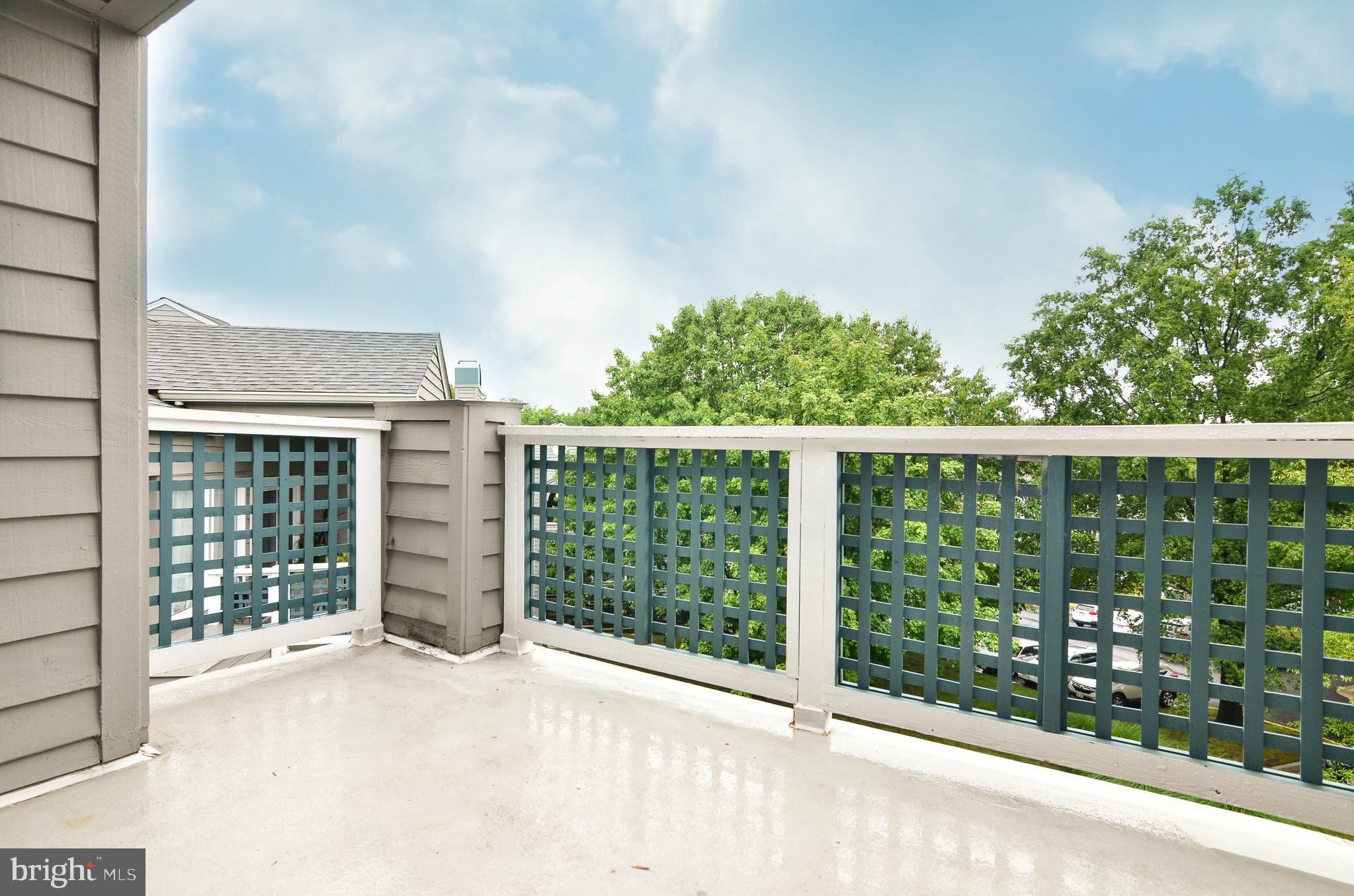 1500 Summerchase Court, Unit 1500E Reston, VA 20194 - Photo 12 of 26 Sliding glass door opens to private balcony