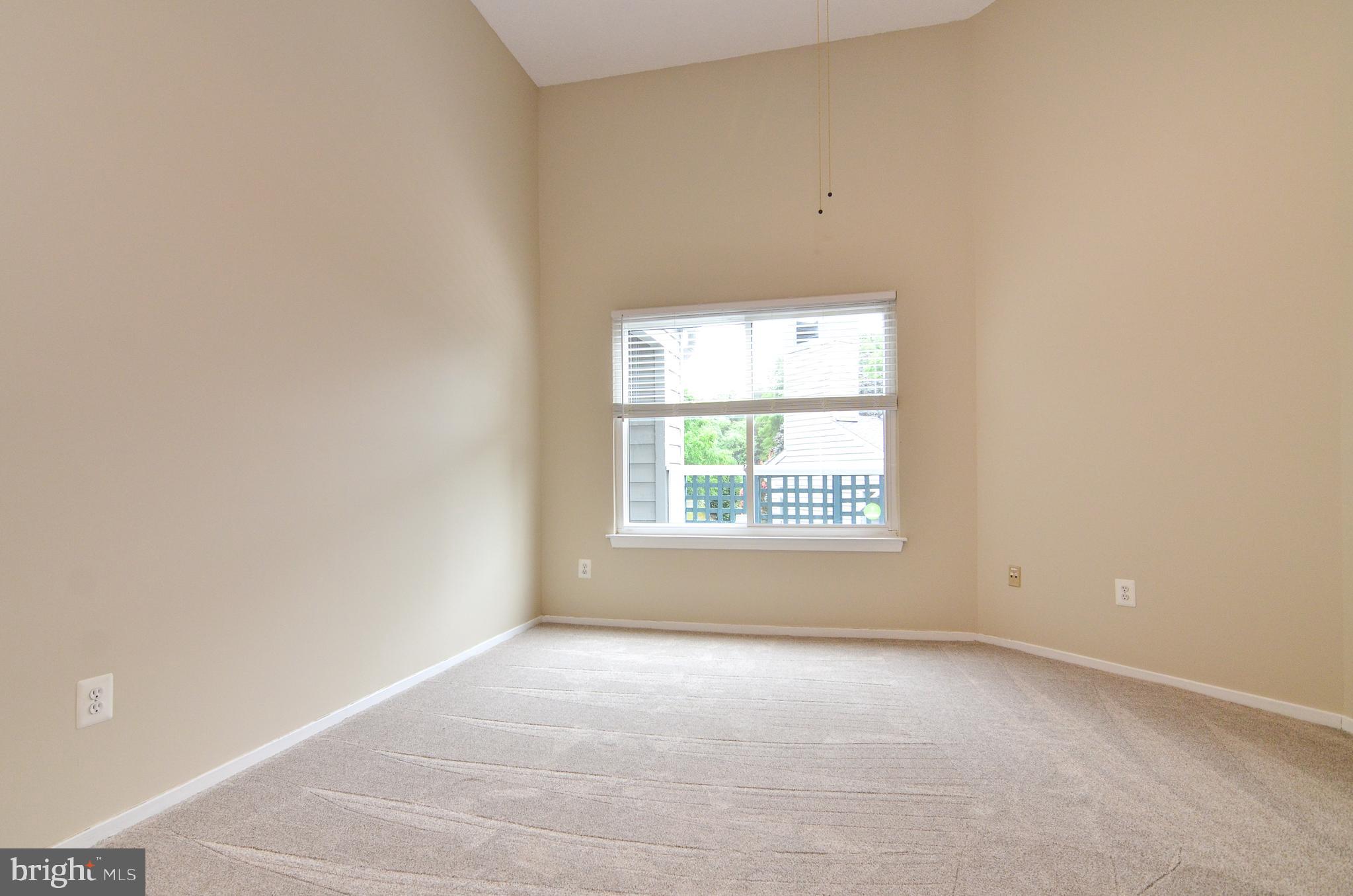 1500 Summerchase Court, Unit 1500E Reston, VA 20194 - Photo 17 of 26 Second bedroom with elevated ceiling