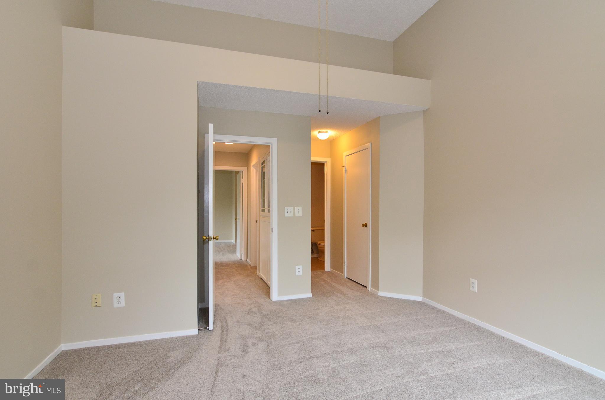 1500 Summerchase Court, Unit 1500E Reston, VA 20194 - Photo 18 of 26 Walk-in closet and dual entry bath off 2nd bedroom