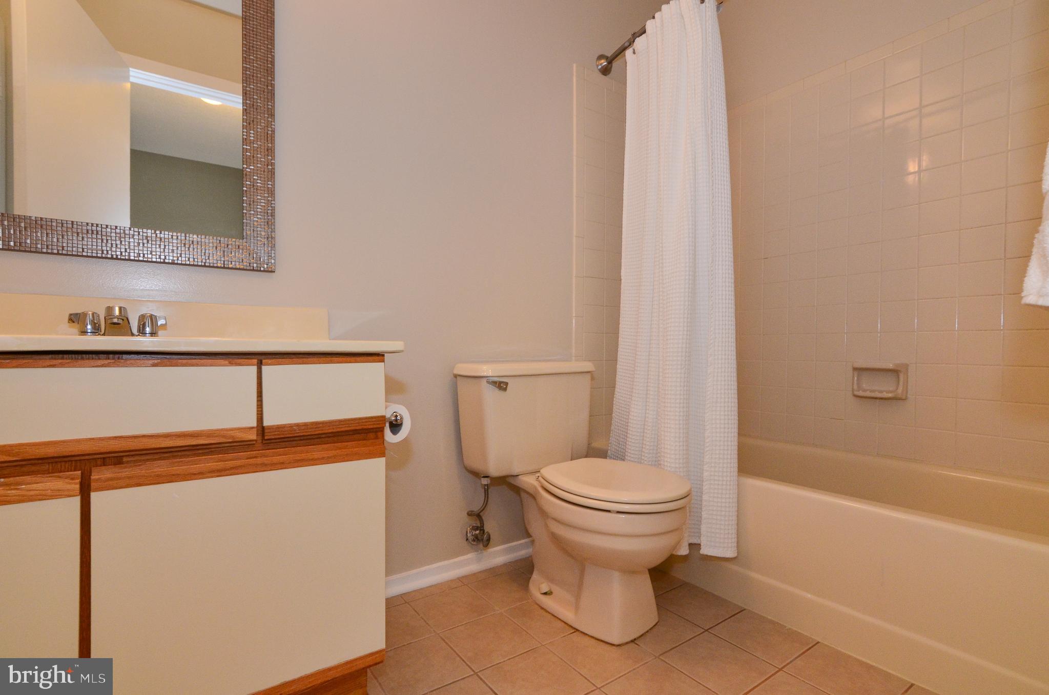 1500 Summerchase Court, Unit 1500E Reston, VA 20194 - Photo 21 of 26 Dual-entry bath