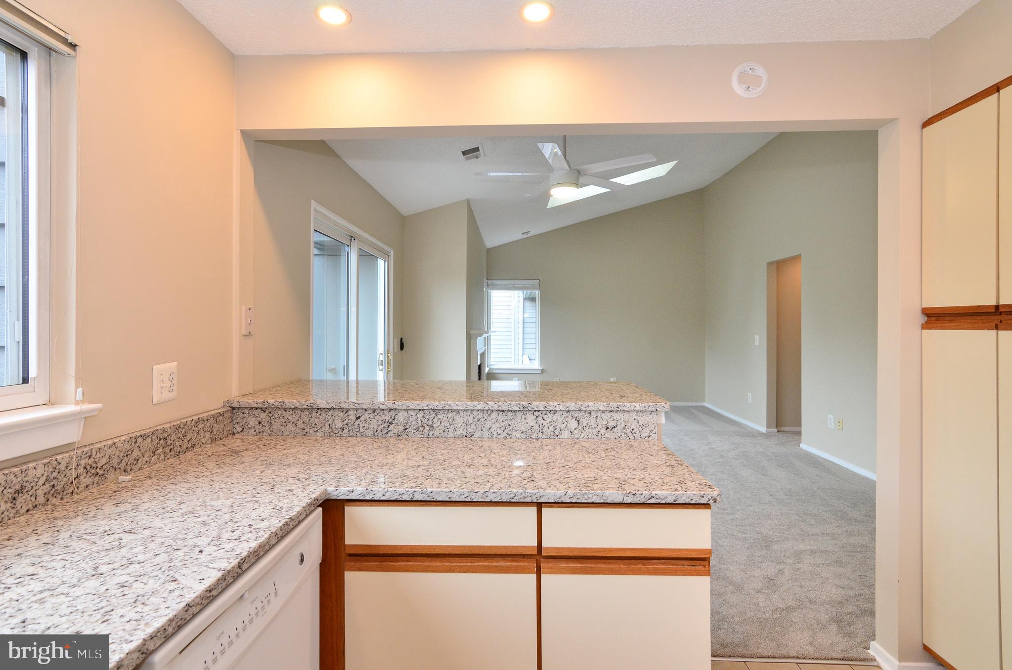 1500 Summerchase Court, Unit 1500E Reston, VA 20194 - Photo 7 of 26 Kitchen opens to dining and living rooms