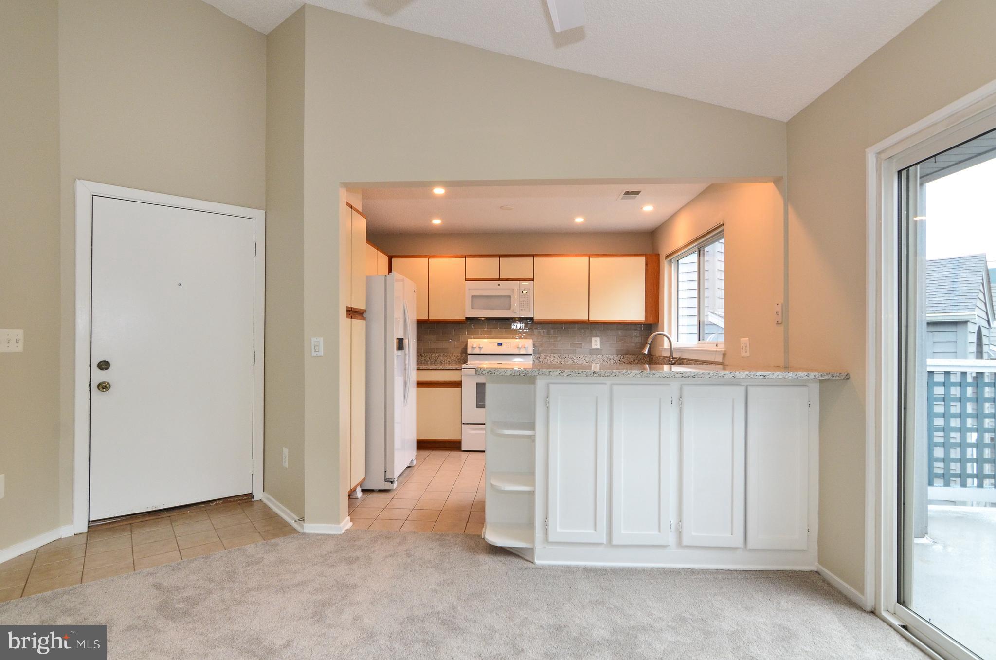 1500 Summerchase Court, Unit 1500E Reston, VA 20194 - Photo 9 of 26 Kitchen and entryway