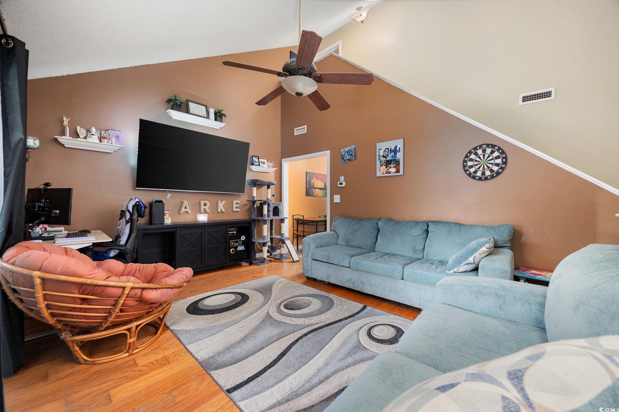 755 Burcale Road, Unit F4 Myrtle Beach, SC 29579 - Photo 15 of 30 Living room with light wood-style flooring, ceiling fan, and high vaulted ceiling