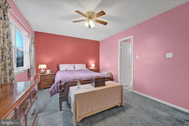 a bed room with a bed and a chandelier