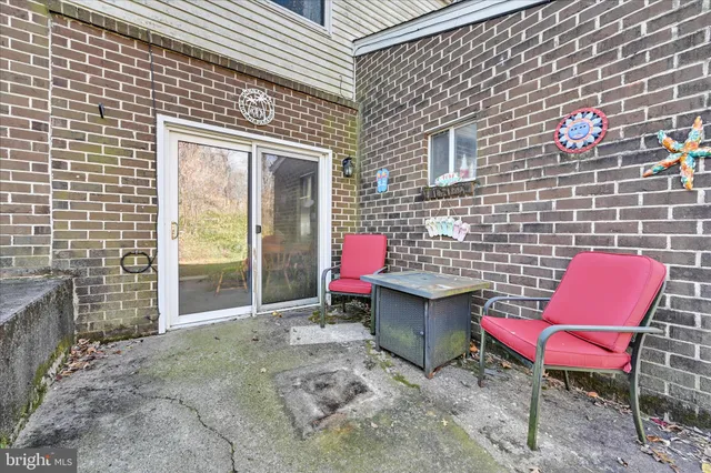 a patio with table and chairs