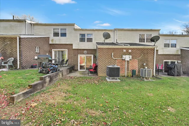 a front view of house with a garden
