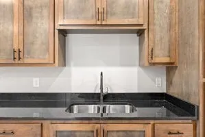 a kitchen with a sink and cabinets