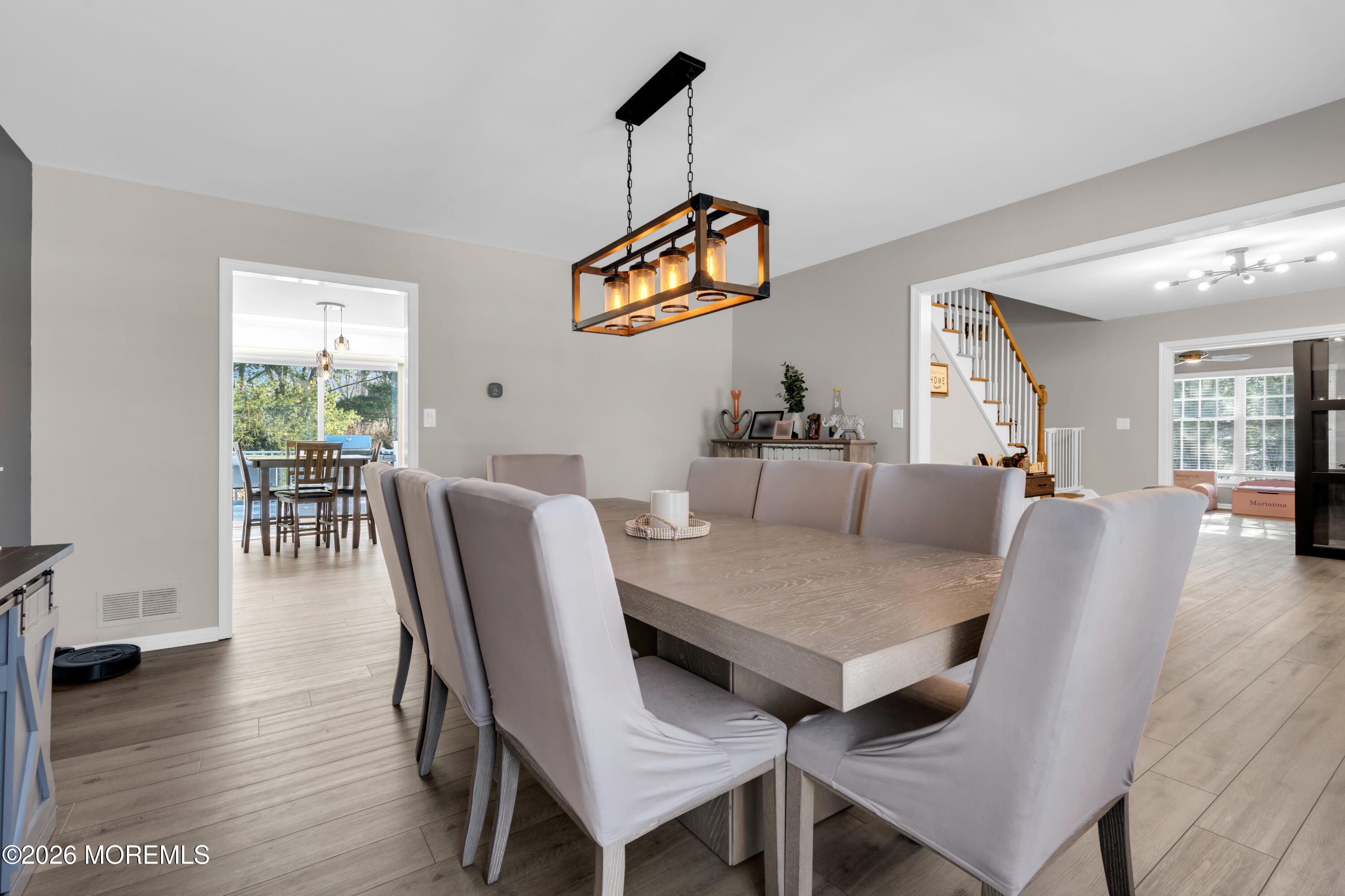 15 Lenape Trail Freehold, NJ 07728 - Photo 12 of 27 a dining room with furniture and wooden floor
