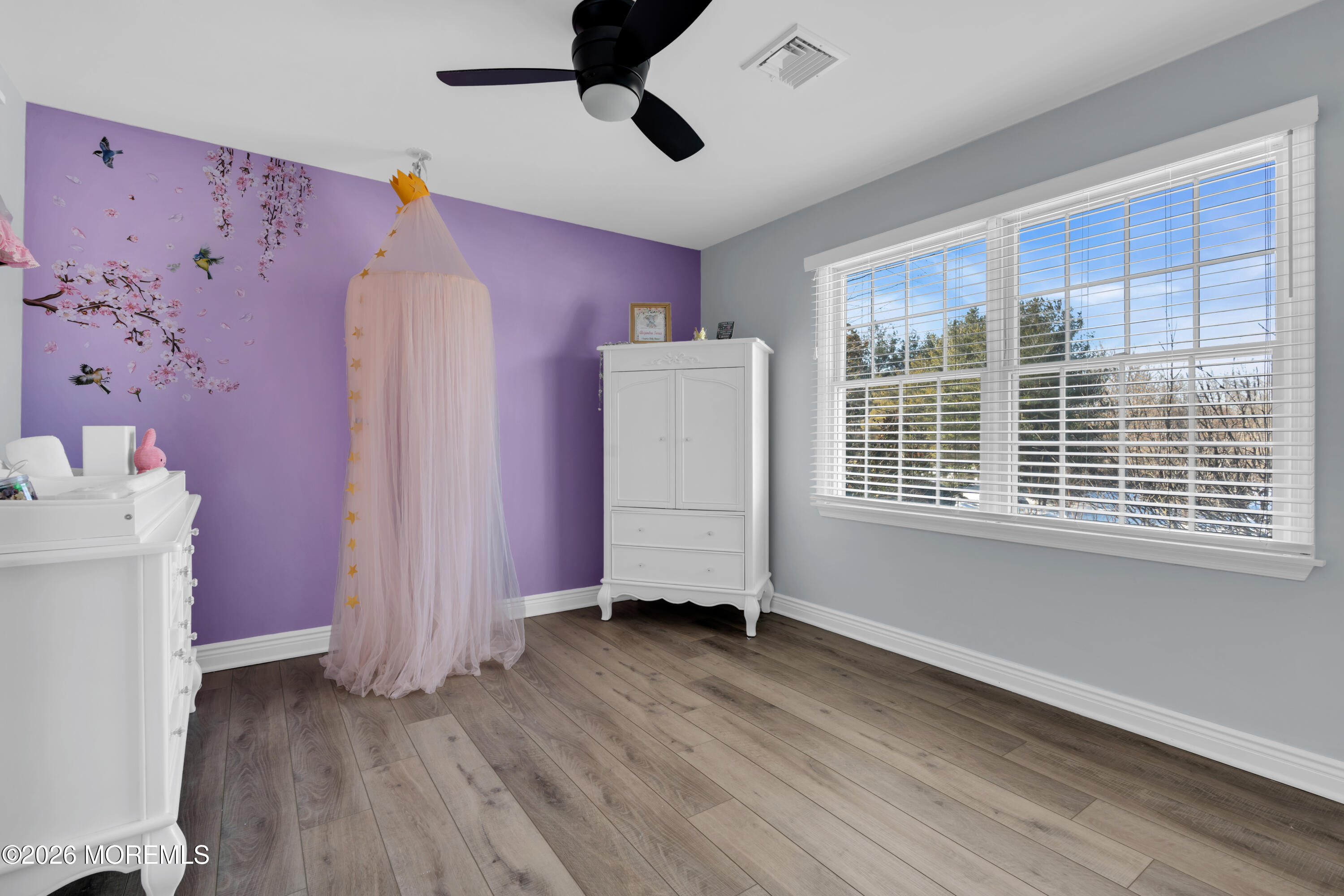 15 Lenape Trail Freehold, NJ 07728 - Photo 16 of 27 wooden floor in an empty room with a window