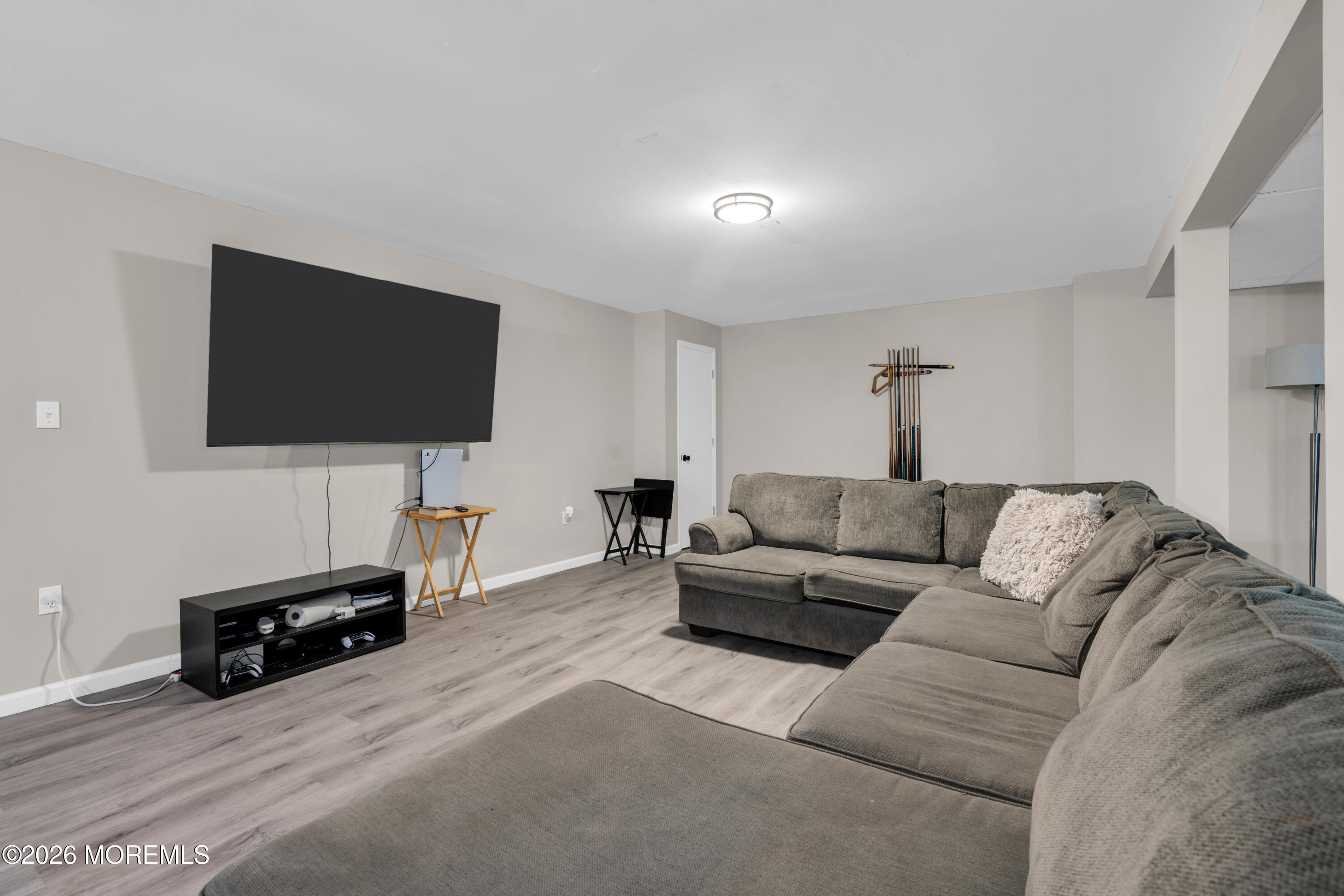 15 Lenape Trail Freehold, NJ 07728 - Photo 20 of 27 a living room with furniture and a flat screen tv