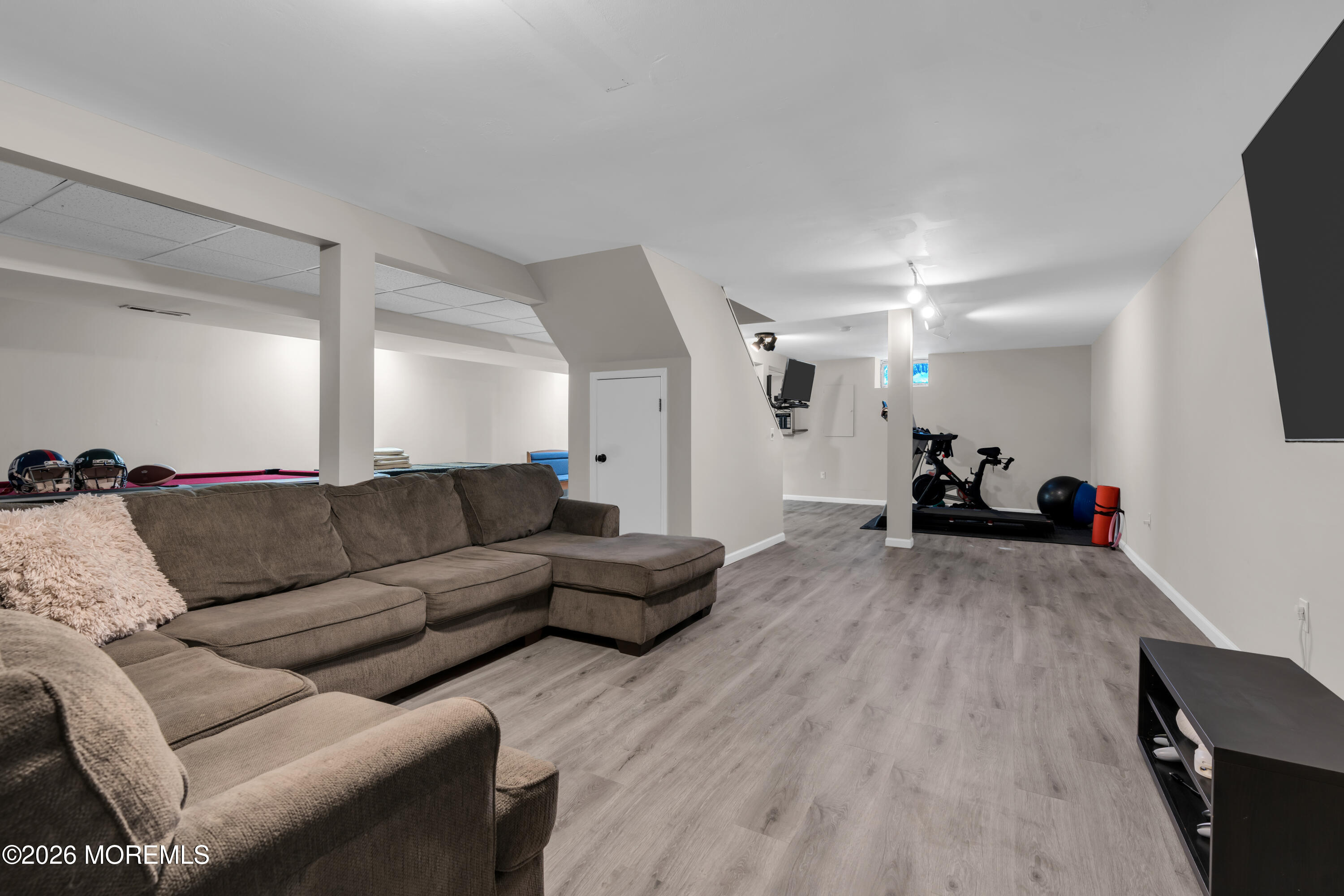 15 Lenape Trail Freehold, NJ 07728 - Photo 21 of 27 a living room with furniture and a flat screen tv