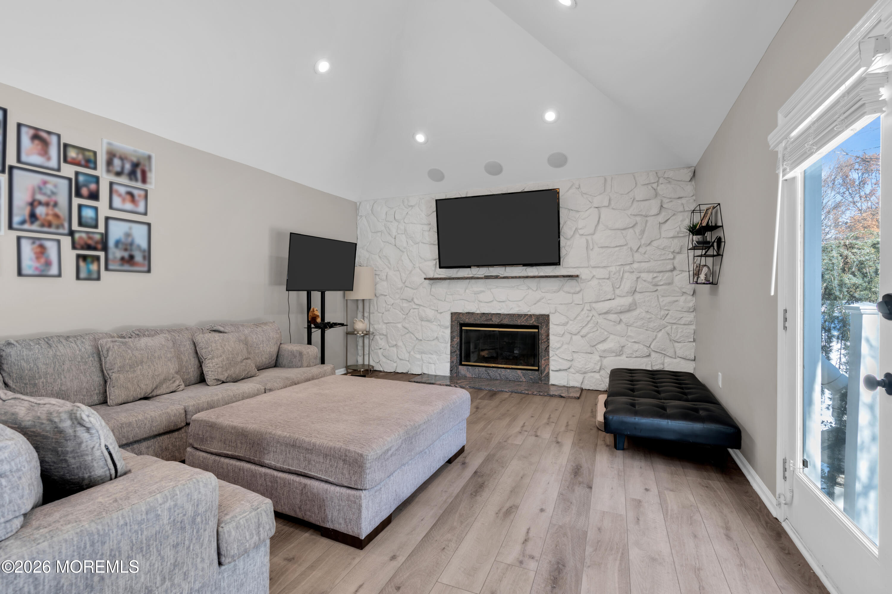 15 Lenape Trail Freehold, NJ 07728 - Photo 25 of 27 a living room with furniture and a fireplace