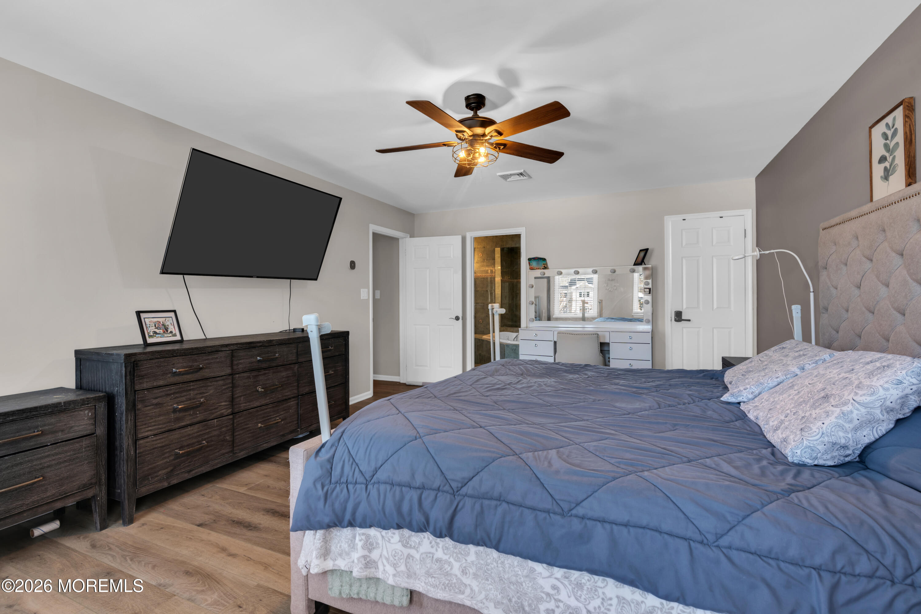 15 Lenape Trail Freehold, NJ 07728 - Photo 3 of 27 a bedroom with a bed and a flat screen tv