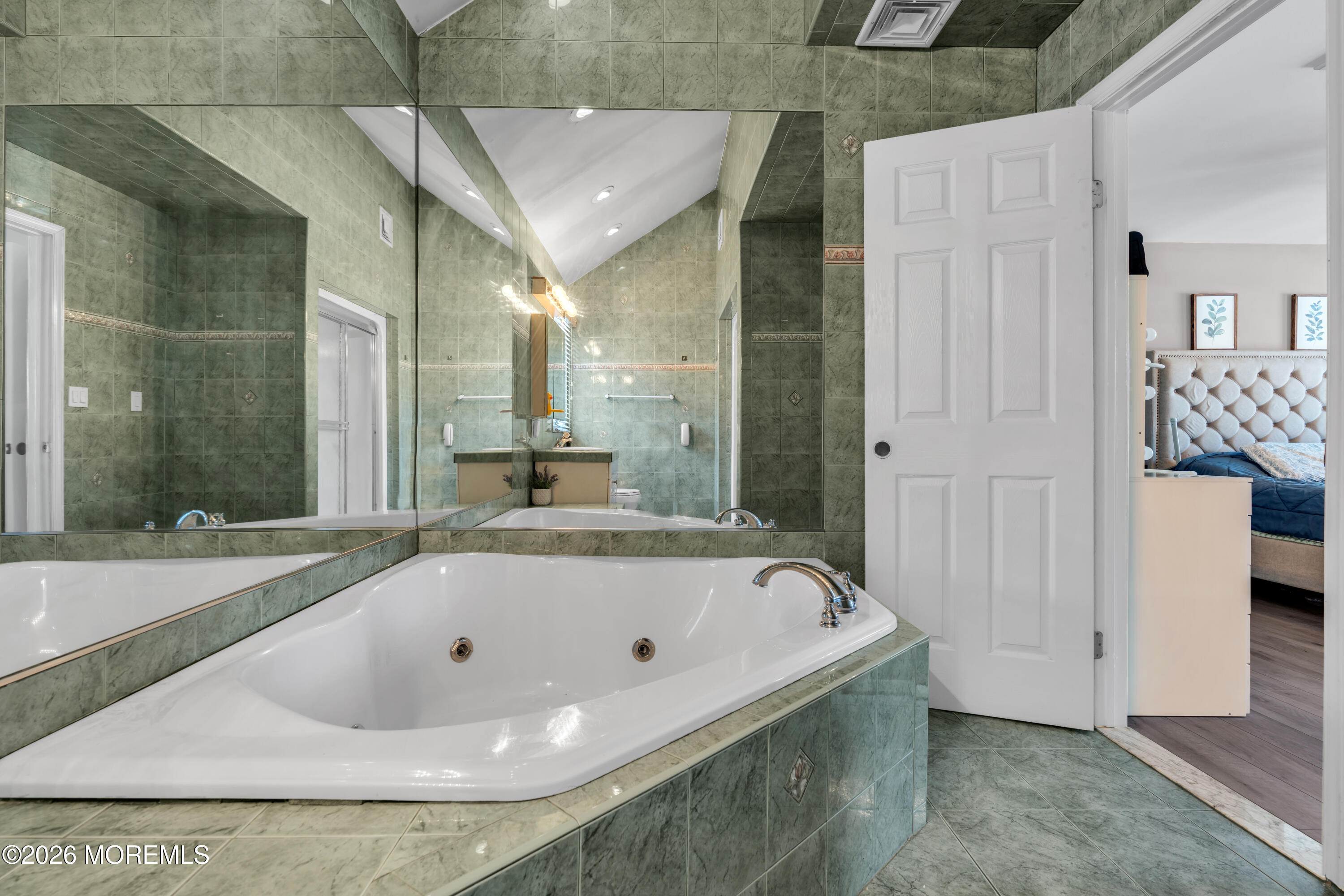 15 Lenape Trail Freehold, NJ 07728 - Photo 6 of 27 a bathroom with a tub and shower