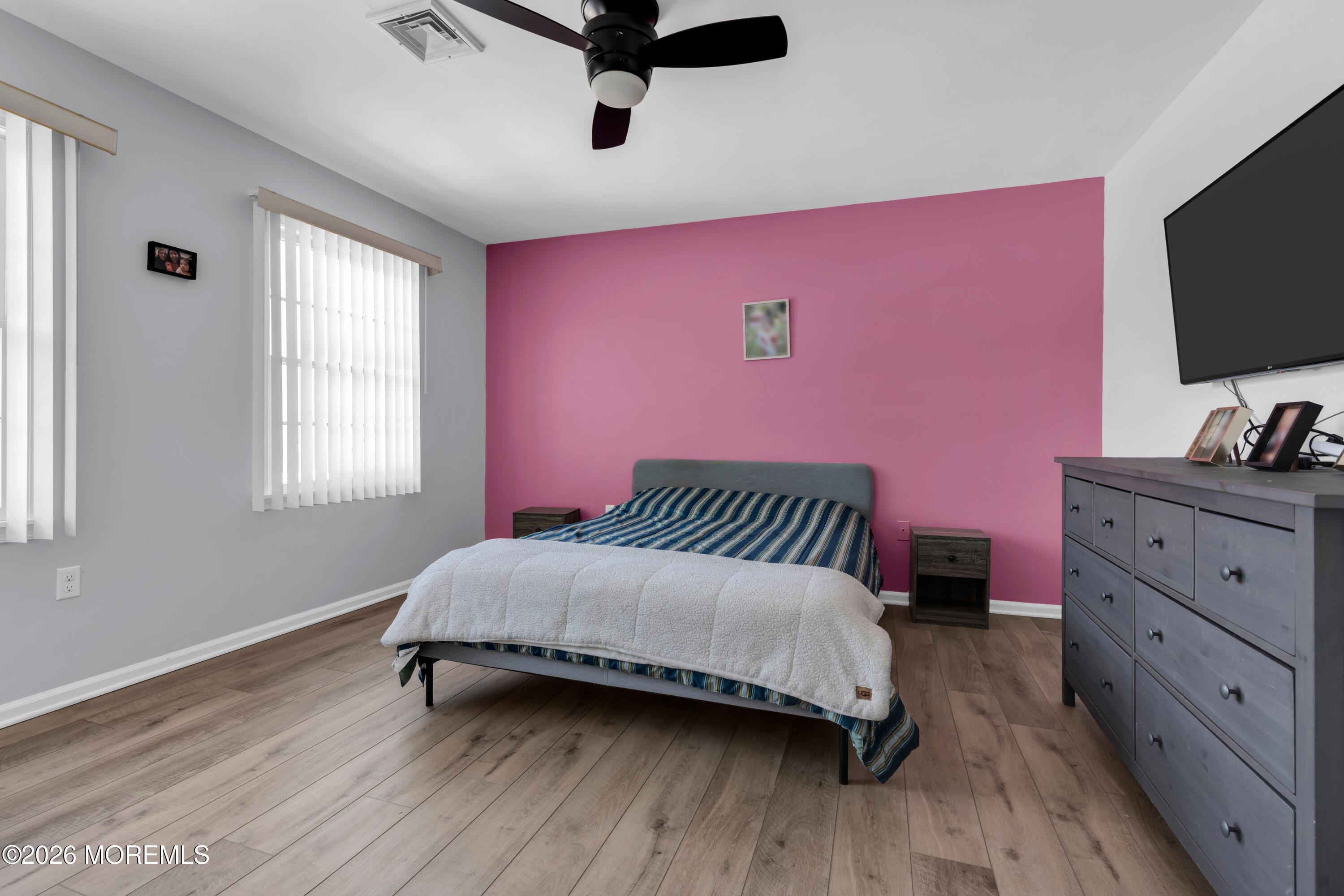 15 Lenape Trail Freehold, NJ 07728 - Photo 7 of 27 a bedroom with a bed and a flat screen tv