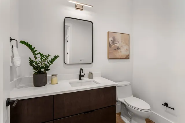 a kitchen with stainless steel appliances granite countertop a sink and a large window