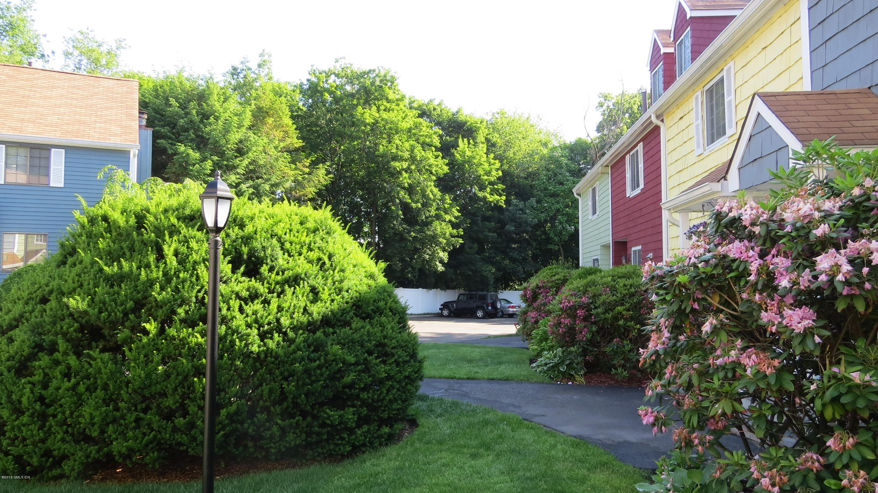 37 Sheep Hill Road, Unit 13 Riverside, CT 06878 - Photo 2 of 11 a view of a house with a yard and garden