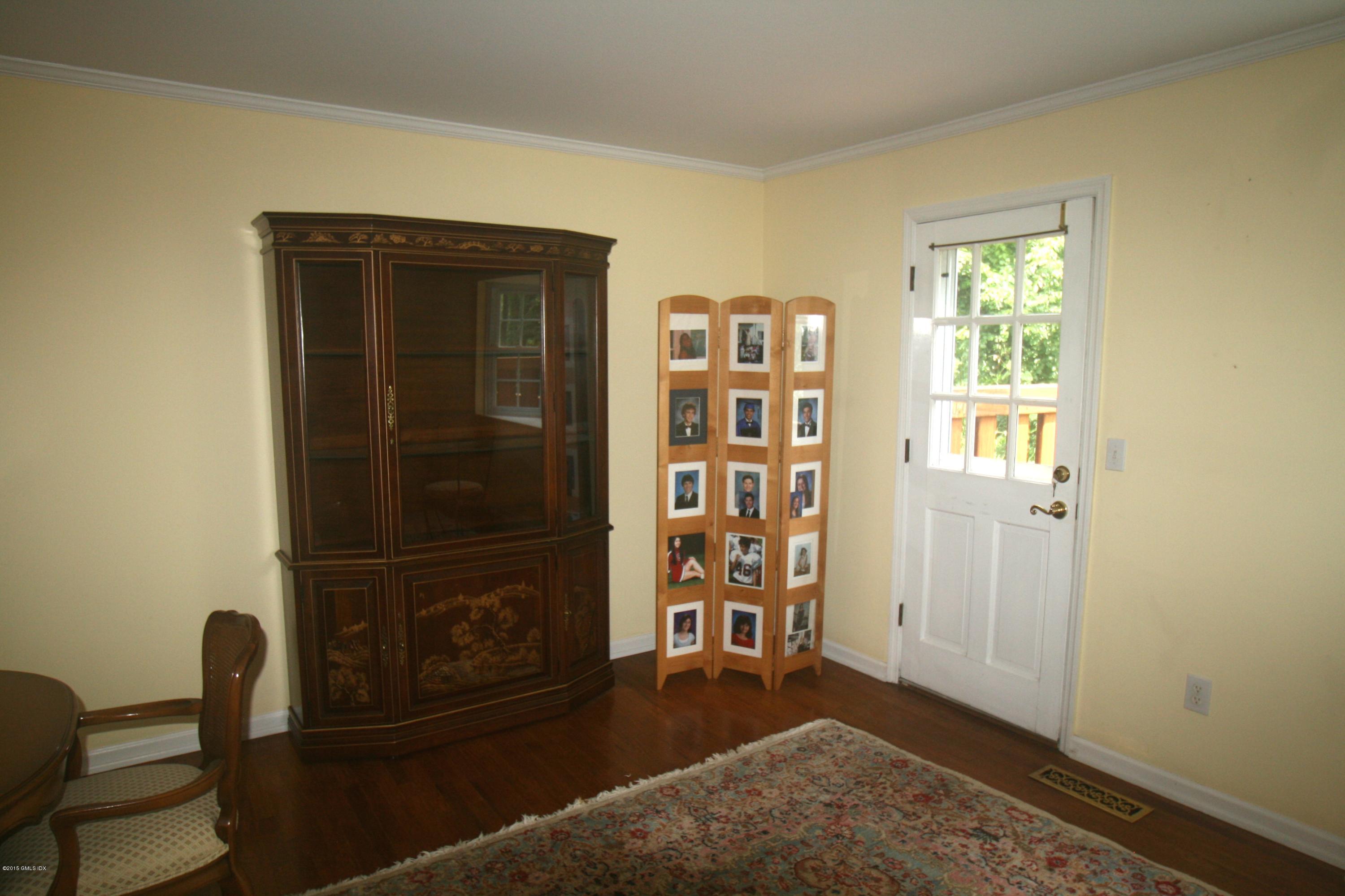37 Sheep Hill Road, Unit 13 Riverside, CT 06878 - Photo 5 of 11 a living room with furniture and a window