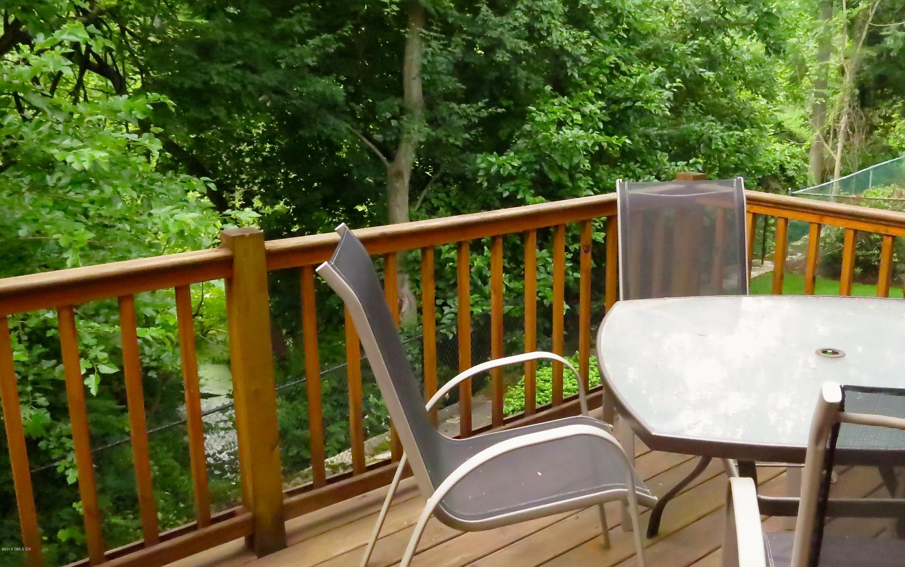 37 Sheep Hill Road, Unit 13 Riverside, CT 06878 - Photo 8 of 11 a view of a balcony with chairs