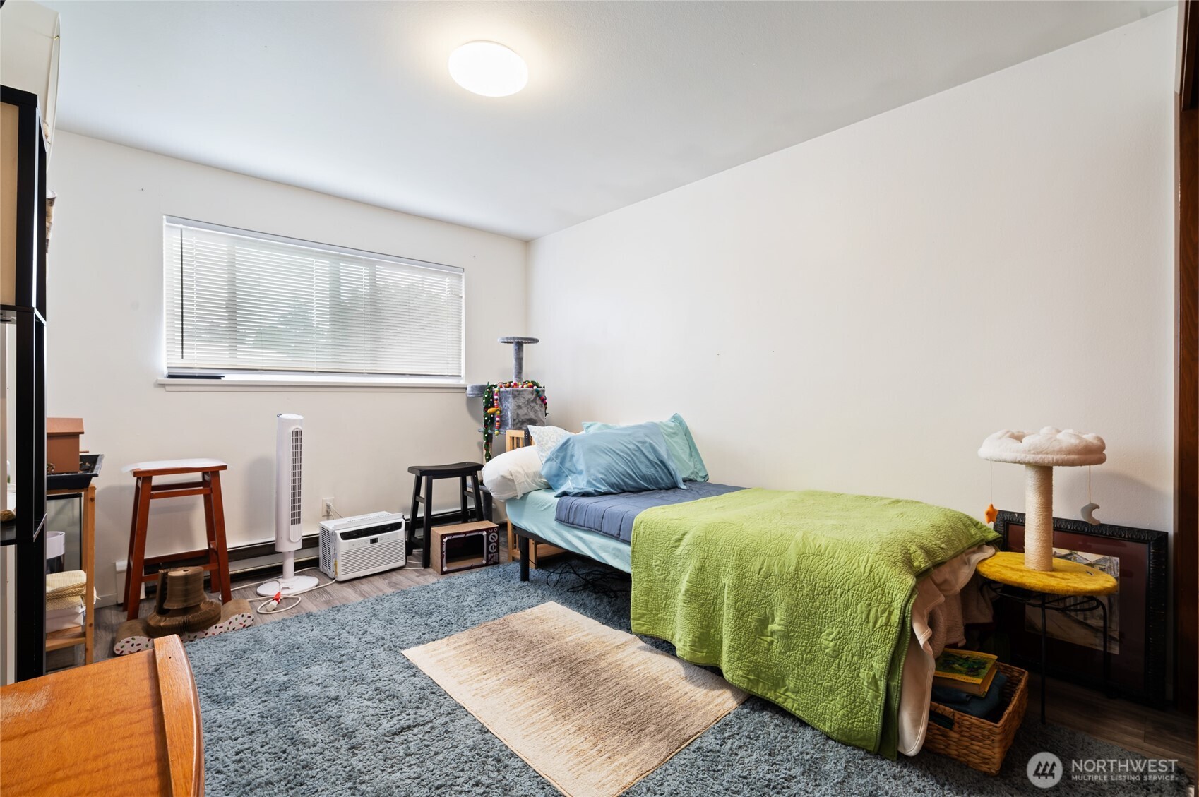 1017 Southwest 154th Street Burien, WA 98166 - Photo 14 of 17 a bedroom with a bed and a table in it