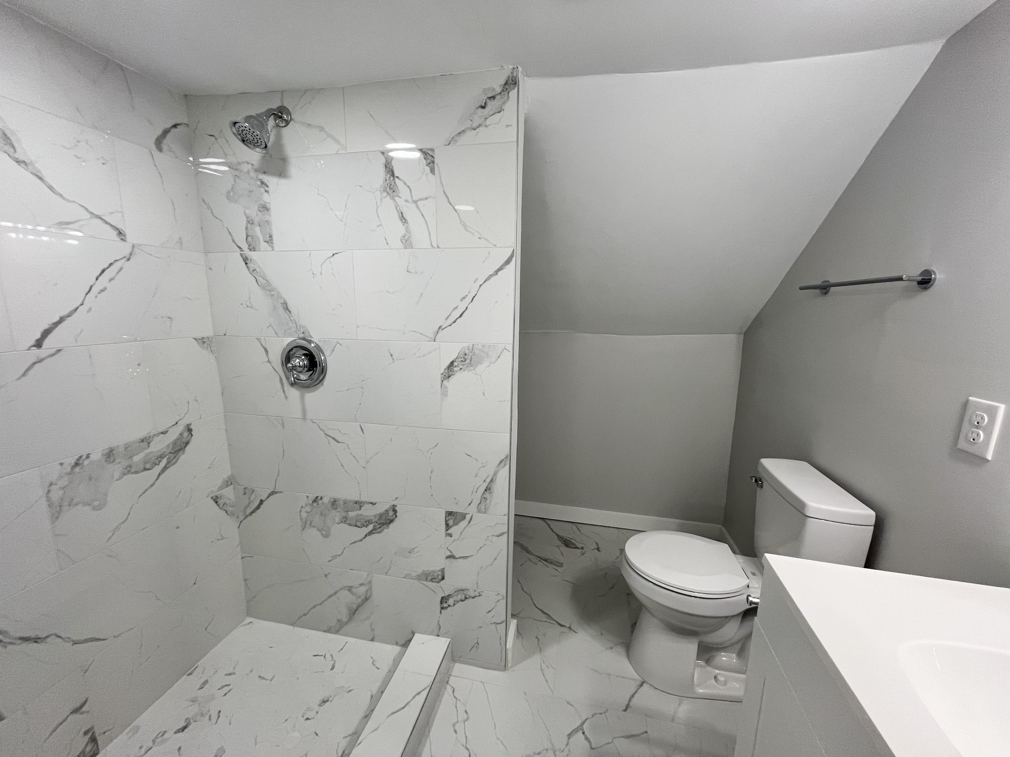 733 East Spring Street Cookeville, TN 38501 - Photo 14 of 23 a white toilet sitting next to a bath tub shower