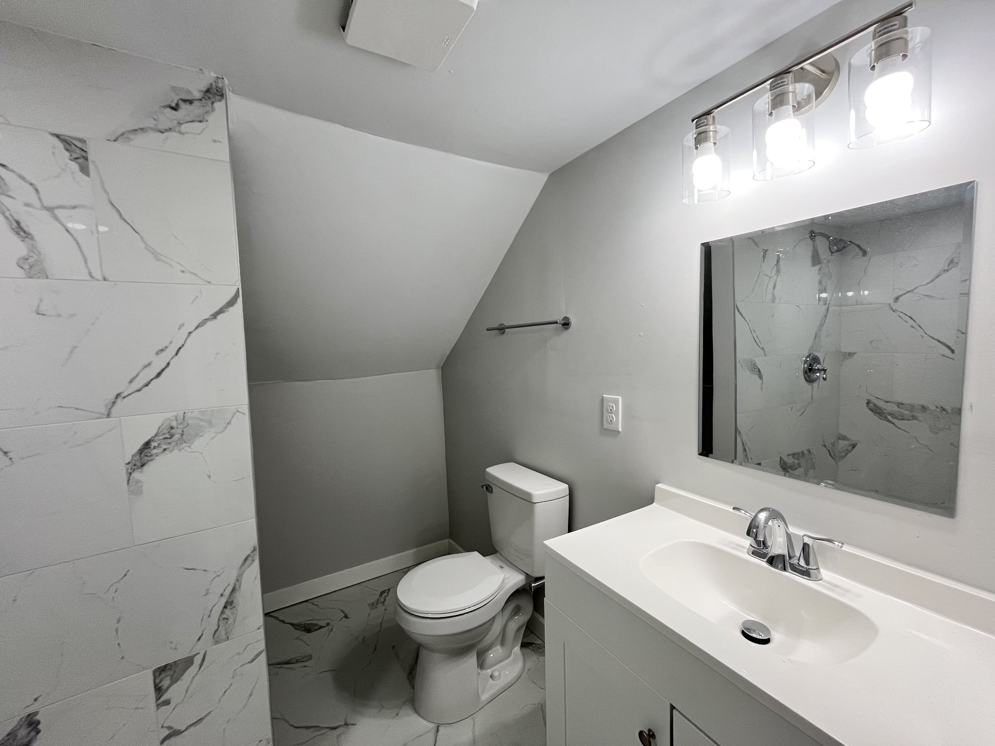 733 East Spring Street Cookeville, TN 38501 - Photo 15 of 23 a bathroom with a toilet sink and mirror