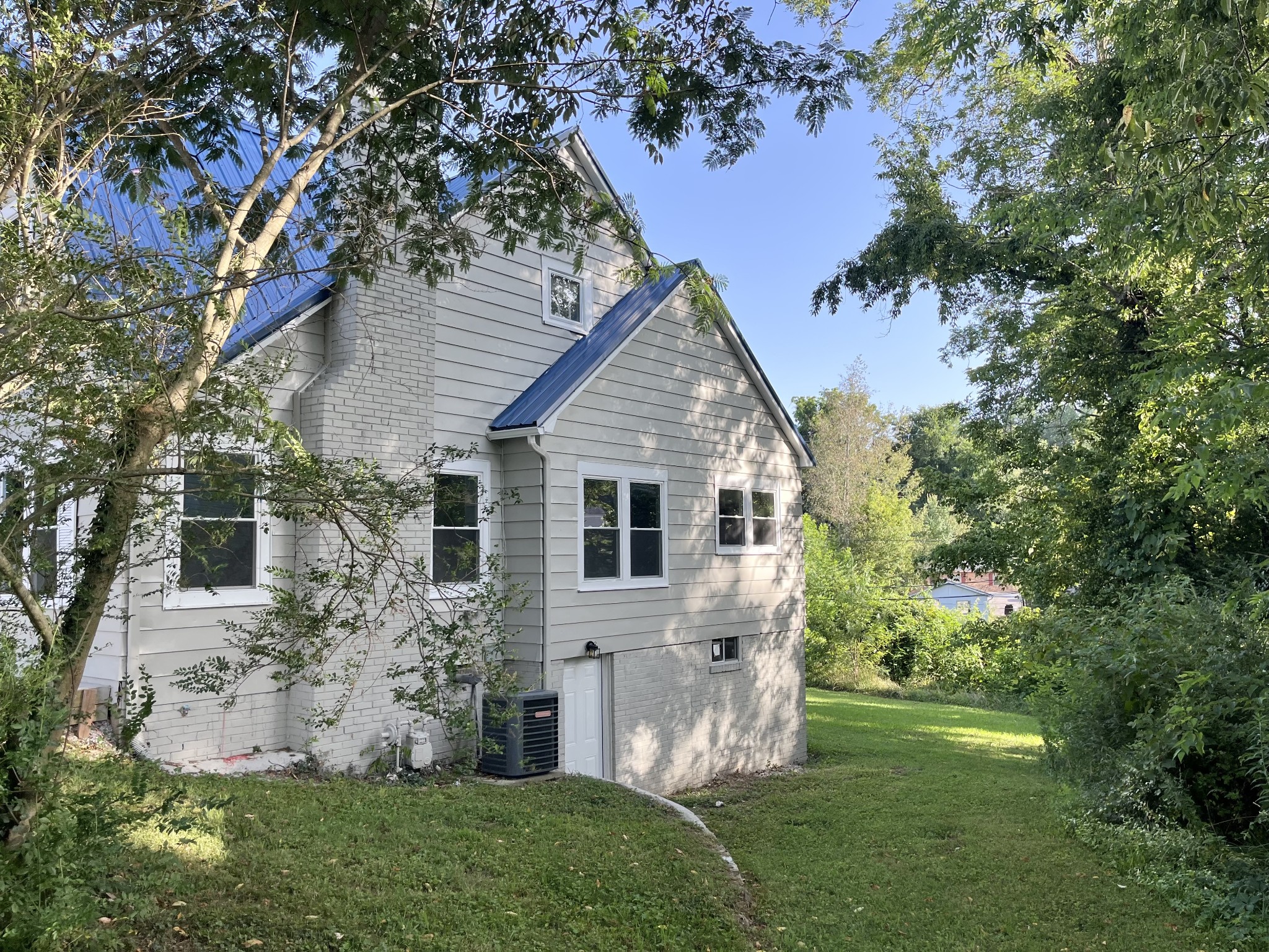 733 East Spring Street Cookeville, TN 38501 - Photo 3 of 23 a view of a house with a yard