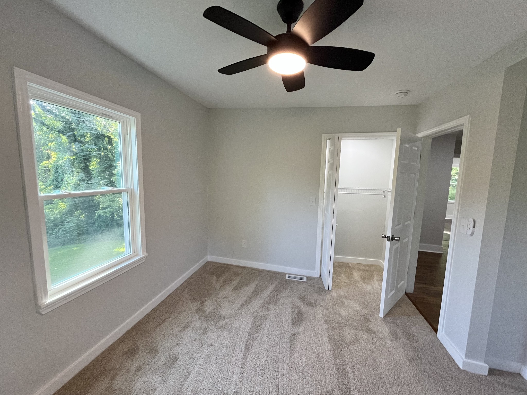 733 East Spring Street Cookeville, TN 38501 - Photo 8 of 23 an empty room with closet and windows