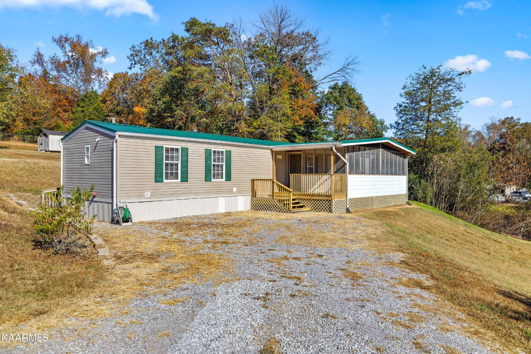 3220 West Wolf Valley Road Clinton, TN 37716 - Photo 1 of 15 a house with trees in the background