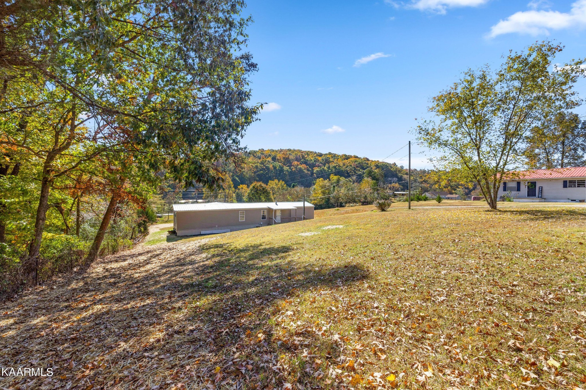 3220 West Wolf Valley Road Clinton, TN 37716 - Photo 14 of 15 a view of outdoor space with garden and trees