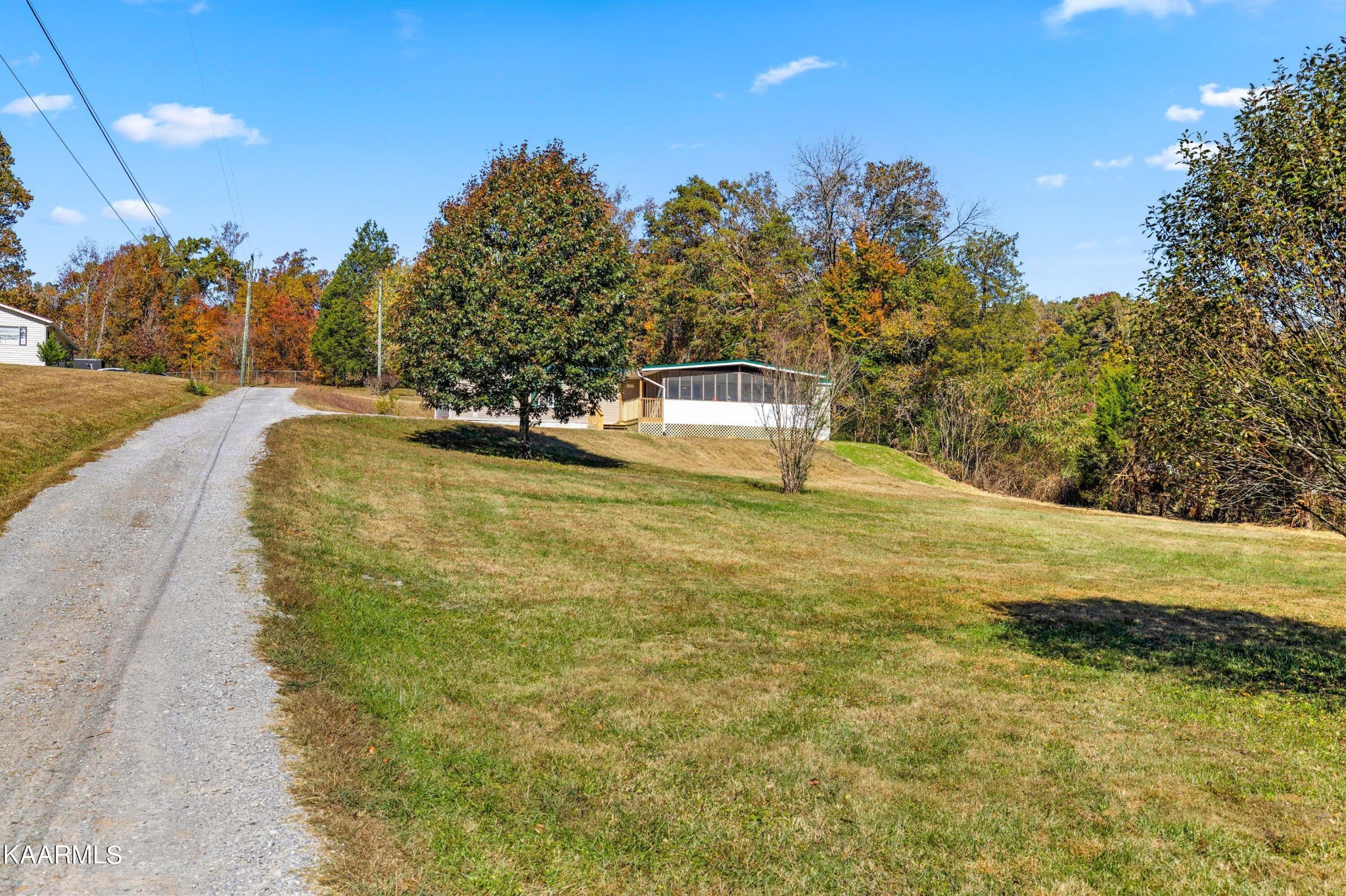 3220 West Wolf Valley Road Clinton, TN 37716 - Photo 15 of 15 a swimming pool with trees in the background