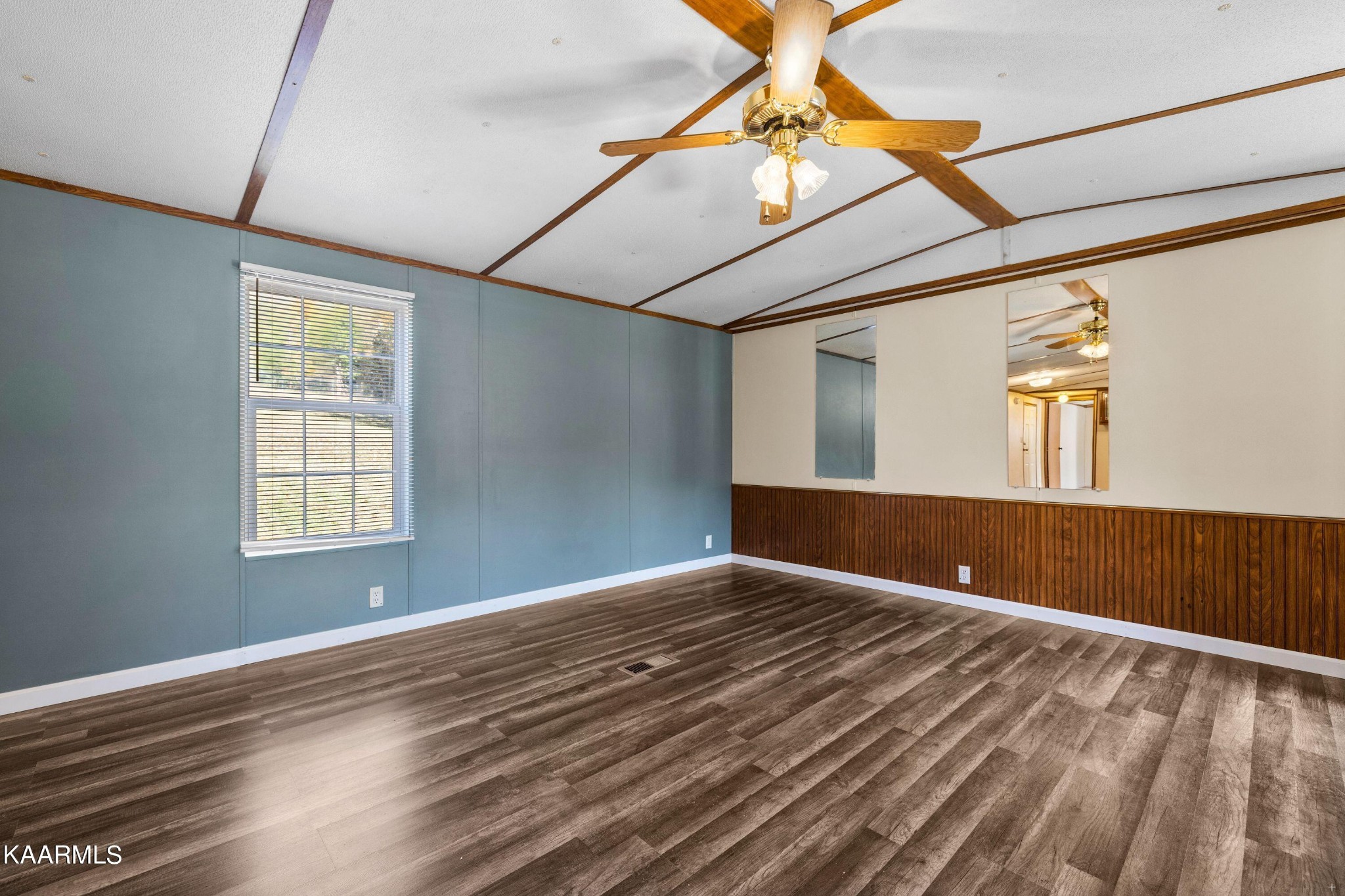 3220 West Wolf Valley Road Clinton, TN 37716 - Photo 2 of 15 a view of an empty room with window and wooden floor