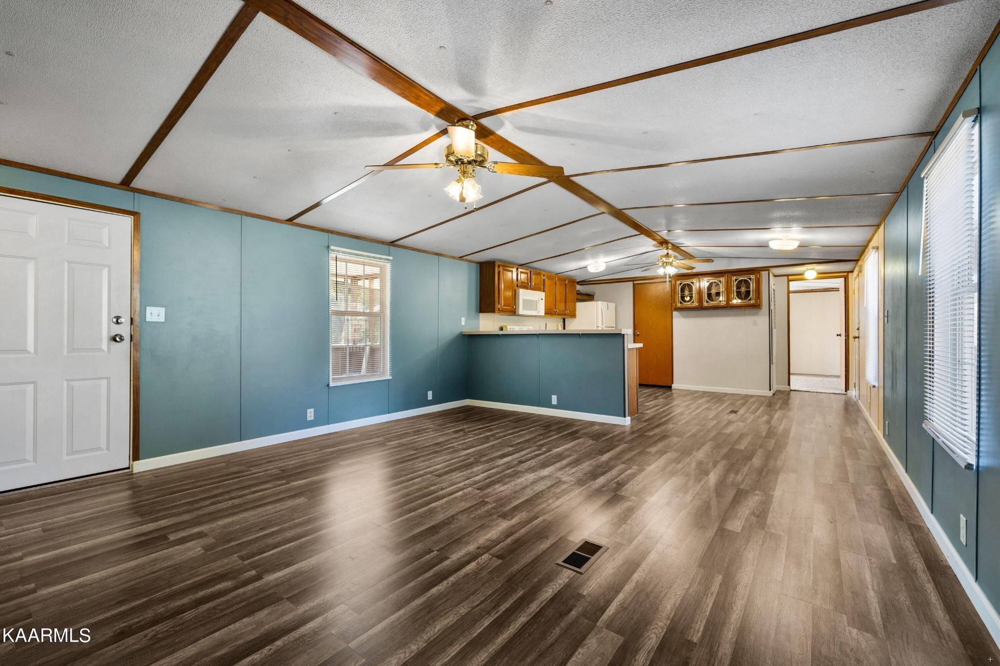 3220 West Wolf Valley Road Clinton, TN 37716 - Photo 3 of 15 a view of empty room with wooden floor