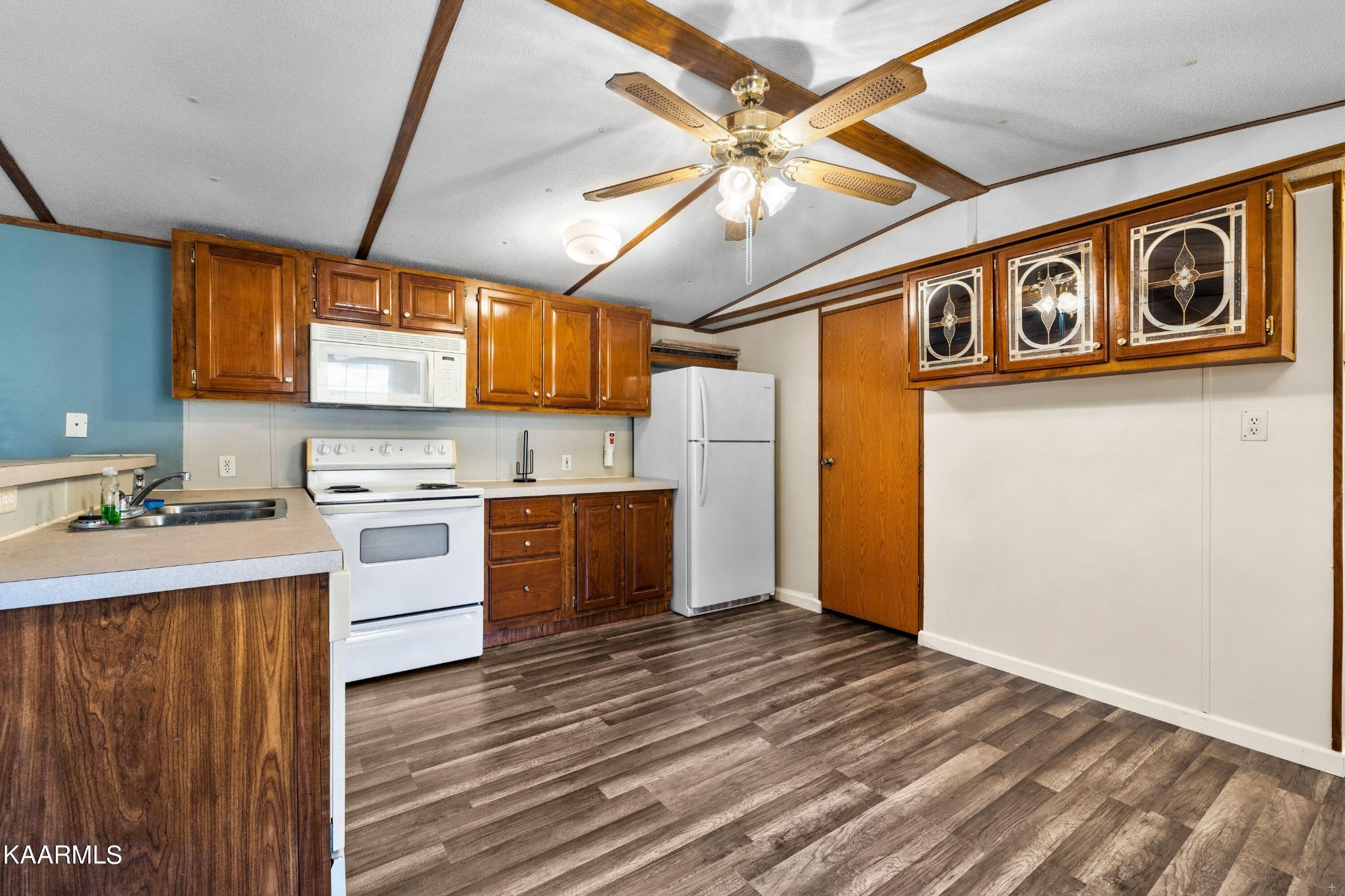 3220 West Wolf Valley Road Clinton, TN 37716 - Photo 4 of 15 a kitchen with stainless steel appliances granite countertop a refrigerator and a stove top oven