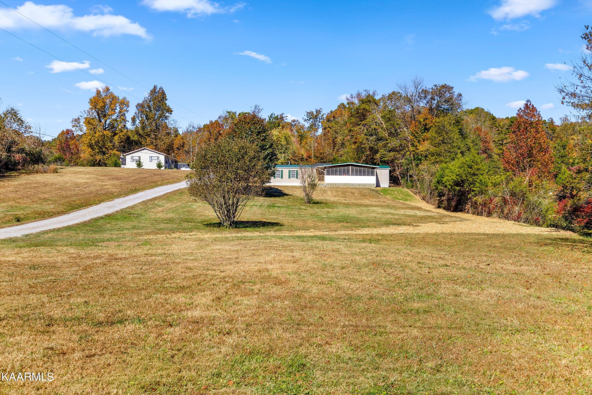 3220 West Wolf Valley Road Clinton, TN 37716 - Photo 6 of 15 a swimming pool with trees in the background