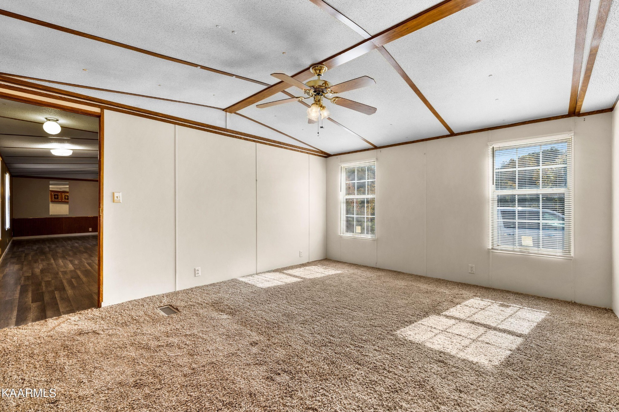 3220 West Wolf Valley Road Clinton, TN 37716 - Photo 7 of 15 a view of livingroom with window and hardwood floor