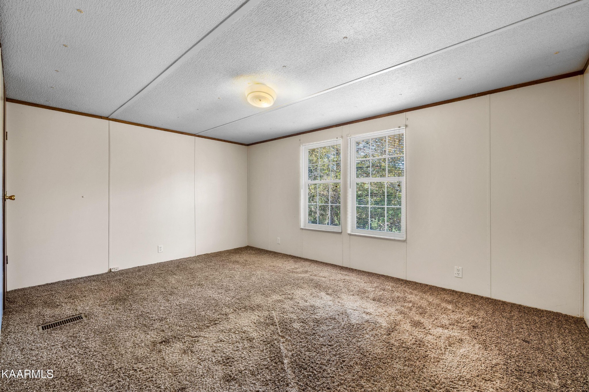 3220 West Wolf Valley Road Clinton, TN 37716 - Photo 9 of 15 a view of an empty room with a window